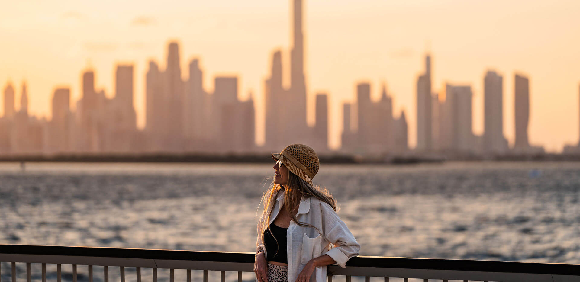 Traveller taking in the Dubai skyline from the waterfront