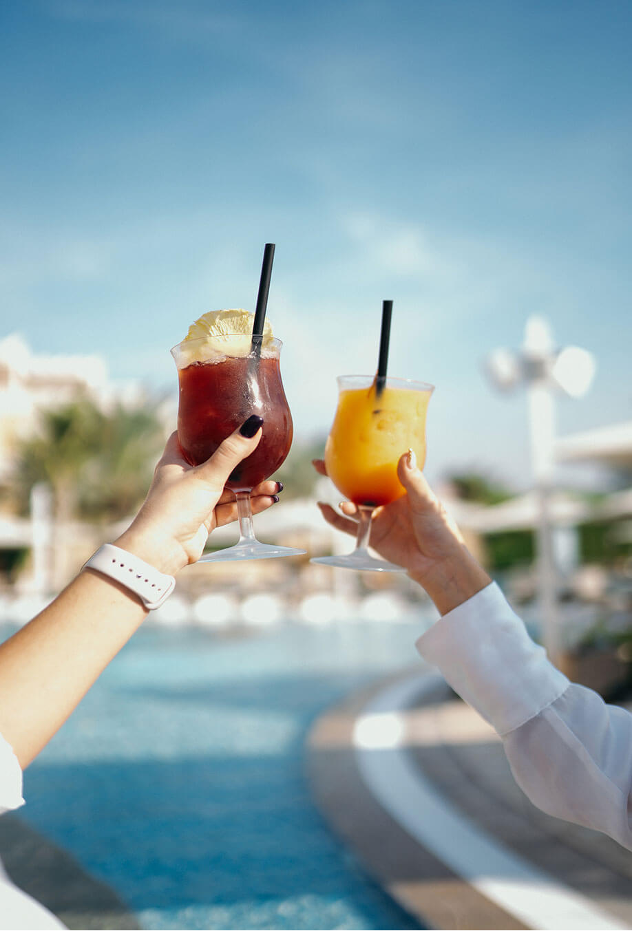 Cocktails by a Dubai beach club pool